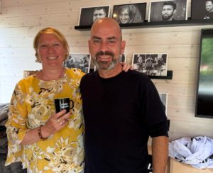 President of Scan Design Foundation Fidelma McGinn standing with Human Library founder Ronni Abergel inside the Human Librarys office in the Reading Garden in Copenhagen.